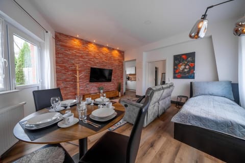 Bed, TV and multimedia, Living room, Seating area, Dining area