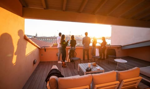 Patio, People, Solarium, View (from property/room), Food and drinks, Seating area, Sunset, group of guests