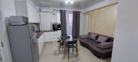 Kitchen or kitchenette, Living room, Dining area, oven, stove, air conditioner