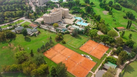 Property building, Staff, Restaurant/places to eat, Day, People, Natural landscape, Activities, Bird's eye view, Billiard, Game Room, Garden, Golfcourse, Hot Tub, Massage, Minigolf, Sauna, Squash, View (from property/room), Balcony/Terrace, Spa and wellness centre/facilities, Fitness centre/facilities, Food and drinks, Other, Decorative detail, Tennis court, Cycling, Animals, Guests, Garden view, Lake view, Mountain view, Pool view, River view, Area and facilities, Swimming pool, Sports, Entertainment, Breakfast, Italian breakfast, Drinks, children, young children, group of guests, Open Air Bath, Family, furniture, heating, internet, pet friendly, room service, safe, shuttle, storage, sunbed, towels, kitchen, air conditioner