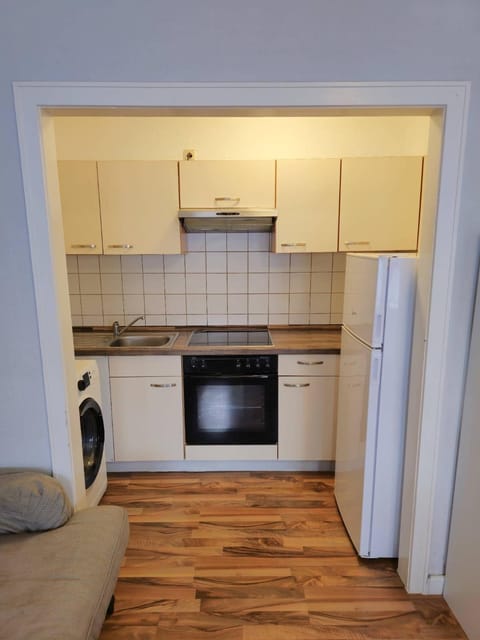 Kitchen or kitchenette, oven, stove, washing machine