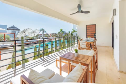 View (from property/room), Balcony/Terrace, Seating area, Dining area, Pool view