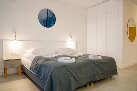 Bed, Photo of the whole room, towels, wardrobe