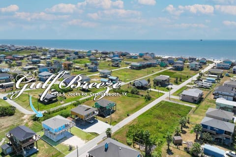 Property building, Day, Bird's eye view, Beach, Text overlay, Time of day, Location