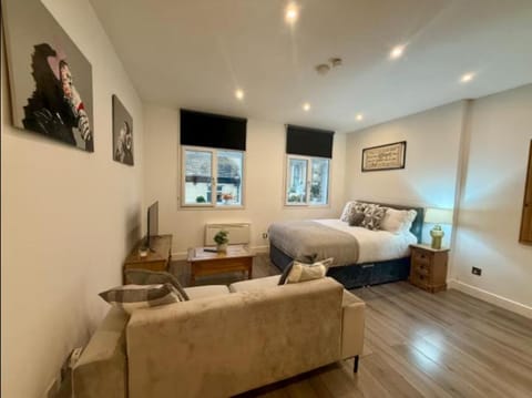 Bed, Living room, Seating area, Bedroom