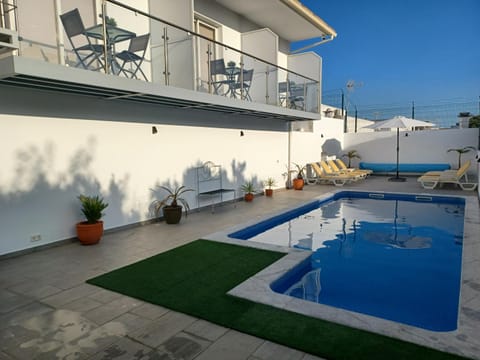 Property building, Day, Pool view, Swimming pool, sunbed