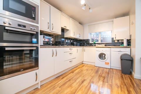 Kitchen or kitchenette, oven, stove, toaster, washing machine, kitchen