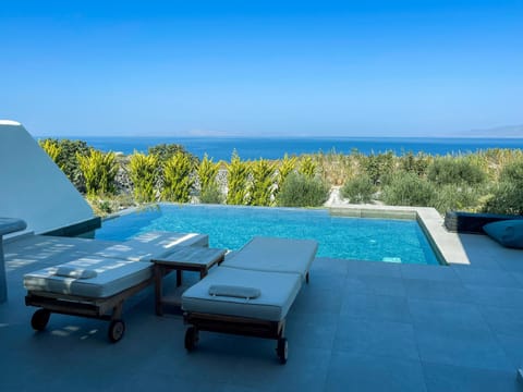 Property building, Patio, Day, Natural landscape, View (from property/room), Balcony/Terrace, Pool view, Sea view, Swimming pool, sunbed
