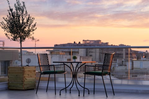 View (from property/room), Balcony/Terrace, Seating area, Sunset