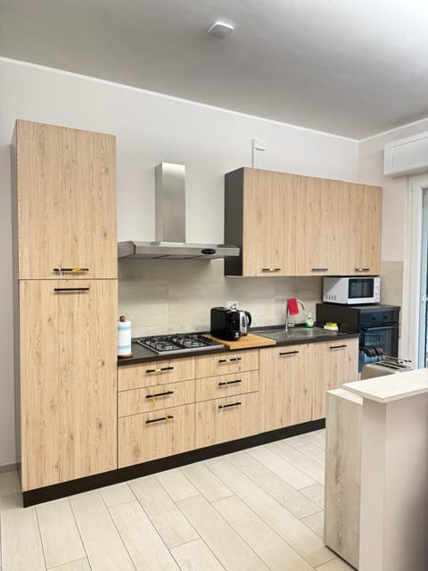 Kitchen or kitchenette, dishwasher, oven, stove