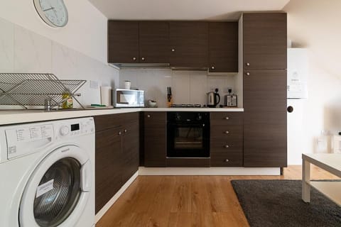 Kitchen or kitchenette, oven, stove, washing machine