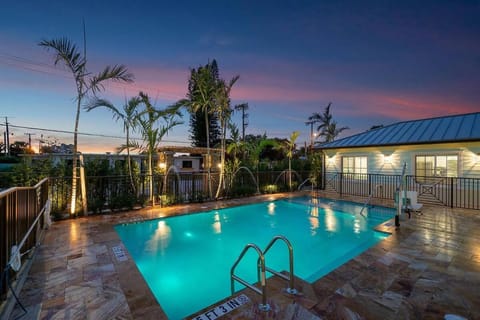 Property building, Patio, Night, Natural landscape, Pool view, Swimming pool, sunbed