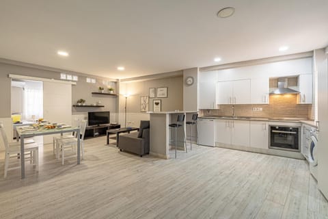Photo of the whole room, Dining area, oven, washing machine, kitchen