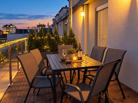 Night, View (from property/room), Balcony/Terrace, Living room, Seating area, Dining area