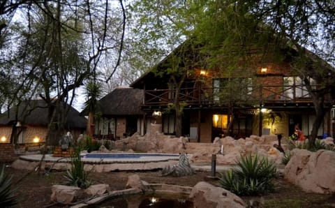 Property building, Patio, Day, Natural landscape, Garden, Garden view, Pool view, Swimming pool