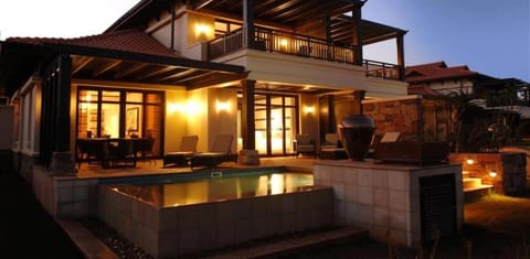 Property building, Patio, Night, View (from property/room), Balcony/Terrace, Pool view, Swimming pool