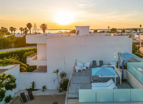 Property building, Natural landscape, Balcony/Terrace, Pool view, Swimming pool, Sunset, sunbed