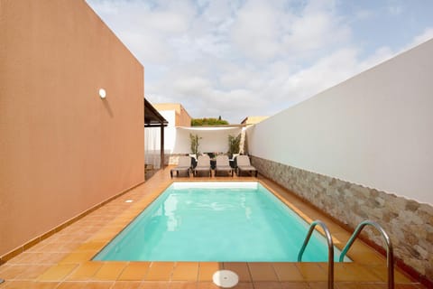 Property building, Living room, Swimming pool