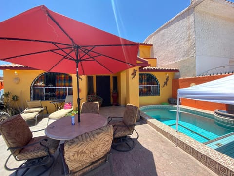 Property building, Patio, Day, Seating area, Pool view, Swimming pool, sunbed
