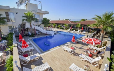 Property building, Patio, Nearby landmark, Day, Seating area, Pool view, Swimming pool, sunbed