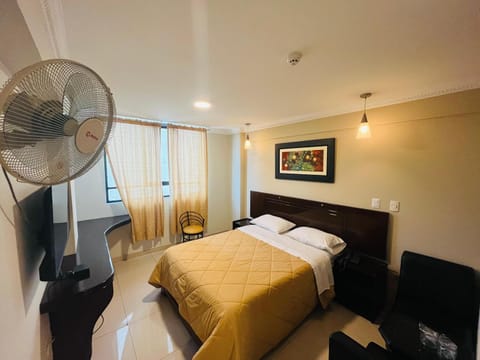 Bed, TV and multimedia, Living room, Seating area, Bedroom