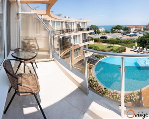 Property building, Patio, Day, Natural landscape, View (from property/room), Balcony/Terrace, Pool view, Sea view, Swimming pool, sunbed