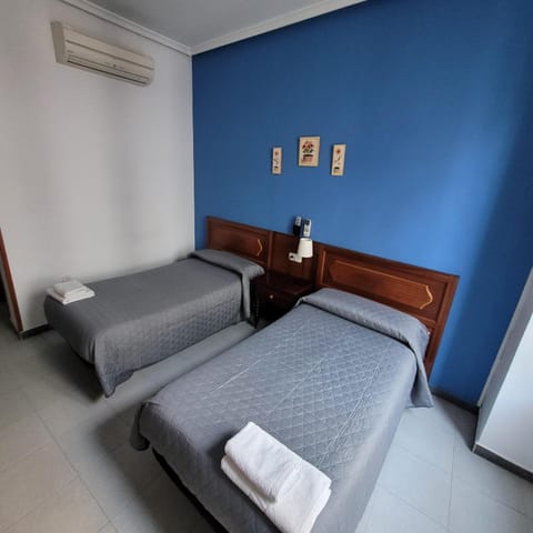 Bed, Photo of the whole room, Bedroom, towels, air conditioner