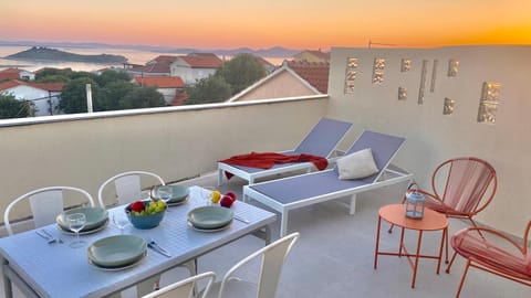 View (from property/room), Balcony/Terrace, Seating area, Dining area, Sunset