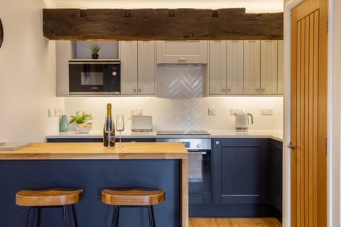 Kitchen or kitchenette, dishwasher, oven, stove