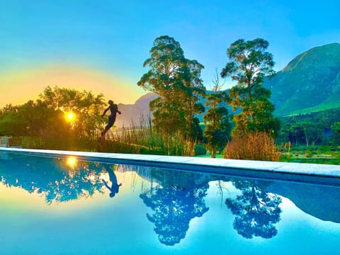Property building, Natural landscape, Mountain view, Swimming pool, Sunset