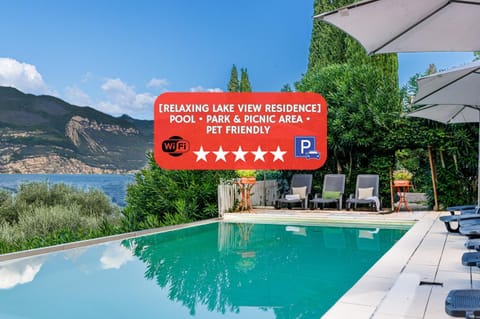 Day, Property logo or sign, Natural landscape, Text overlay, Mountain view, Swimming pool, sunbed