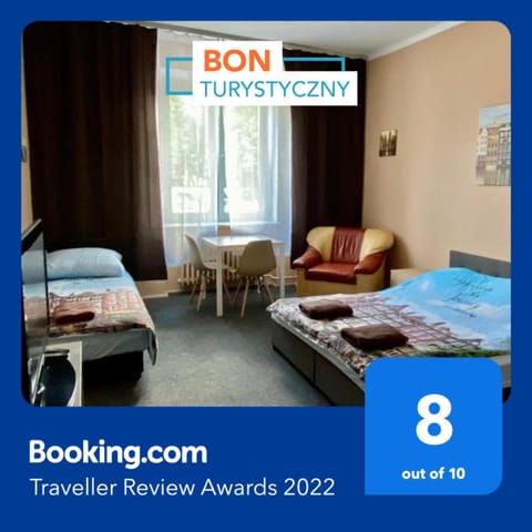 Bed, Property logo or sign, Photo of the whole room, Logo/Certificate/Sign, Bedroom, Text overlay, Certificate/Award