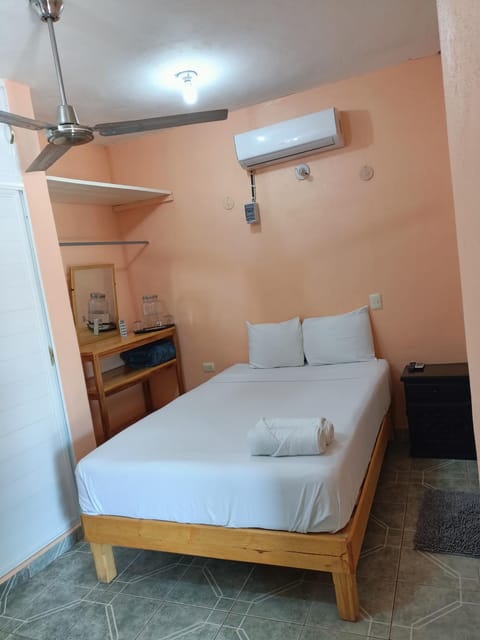 Bed, towels, air conditioner