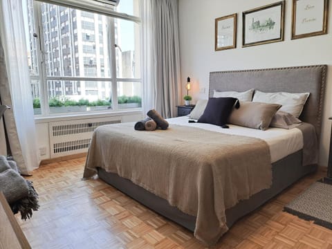 Property building, Bed, Photo of the whole room, Decorative detail, Bedroom, towels, air conditioner