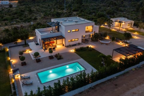 Property building, Patio, Night, Natural landscape, Garden, Pool view, Swimming pool, sunbed