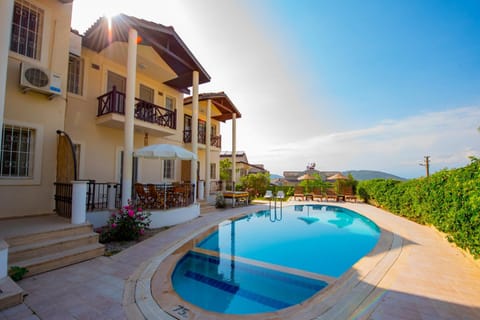 Property building, Patio, Day, Natural landscape, Pool view, Swimming pool, Swimming pool, sunbed