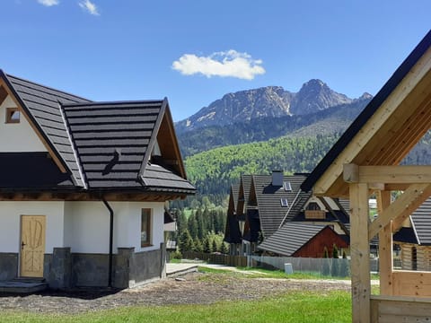 Property building, Nearby landmark, Day, Natural landscape, Mountain view