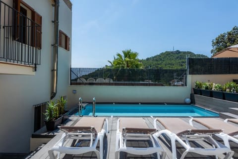 Property building, Living room, Swimming pool