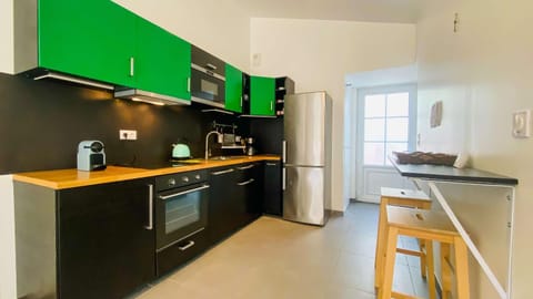 Kitchen or kitchenette, dishwasher, oven, stove