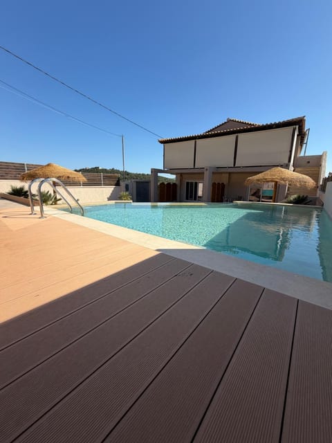 Property building, Day, Natural landscape, Pool view, Swimming pool, sunbed