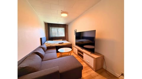 Bed, TV and multimedia, Seating area, Bedroom, towels, wardrobe