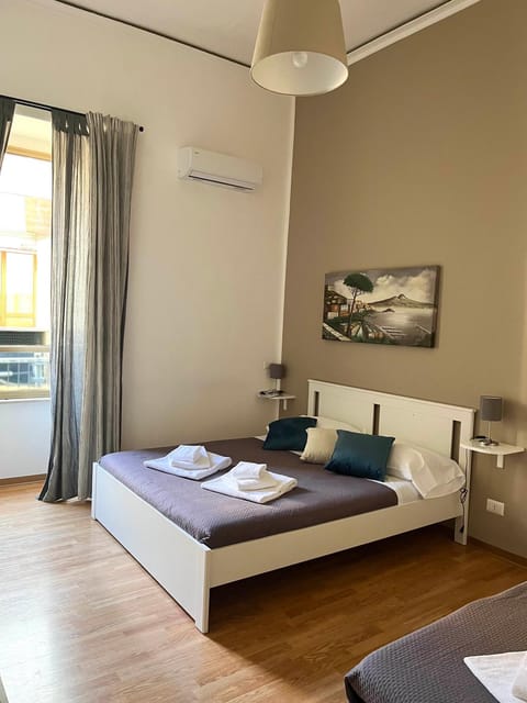 Bed, Photo of the whole room, Bedroom, towels, air conditioner
