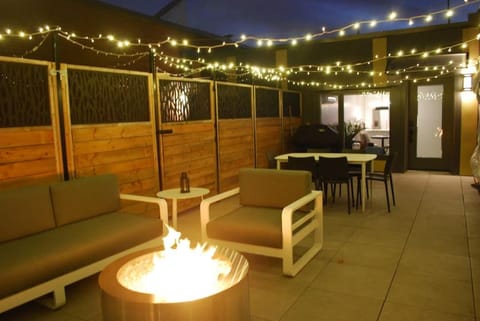 Patio, Night, Seating area, fireplace
