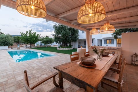 Patio, Living room, Seating area, Pool view, Swimming pool