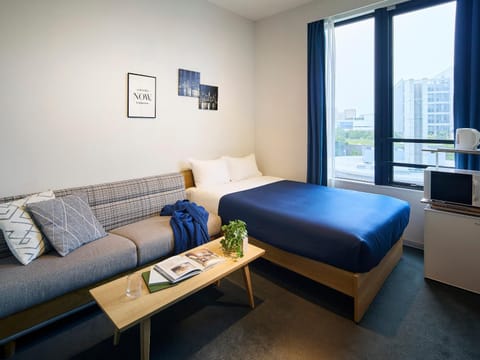 Bed, Living room, Seating area, Bedroom