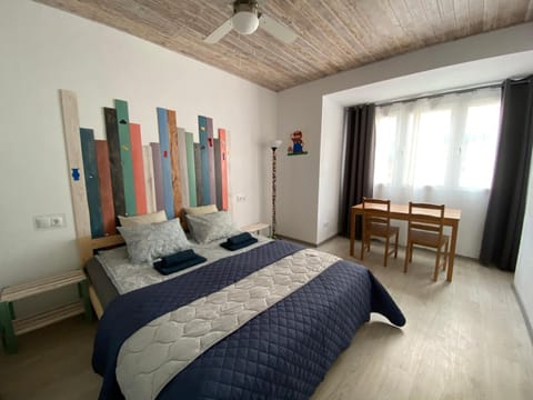 Bed, Living room, Seating area, Bedroom