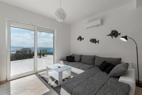 Activities, View (from property/room), Living room, Seating area, Beach, Pool view, Sea view