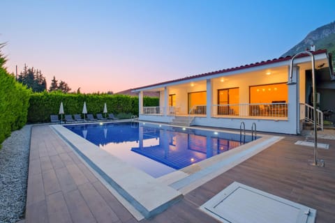 Property building, Patio, Natural landscape, Swimming pool
