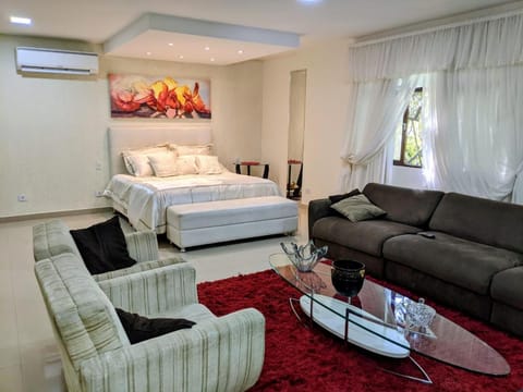 Bed, Living room, Seating area, Bedroom