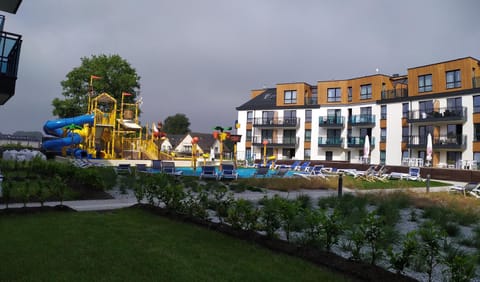 Property building, Day, Natural landscape, Children play ground, Garden, Aqua park, Aqua park, Evening entertainment, Pool view, Swimming pool